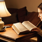 ** A cozy living room scene. Someone is reading a physical book by the warm light of a table lamp. No screens are visible. Maybe a cup of tea is nearby. Focus on the feeling of peace and analog simplicity.

**